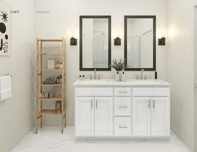 full bath with double vanity, marble finish floor, baseboards, and a sink