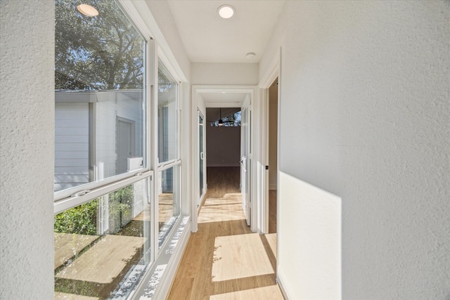 hallway with light wood-type flooring