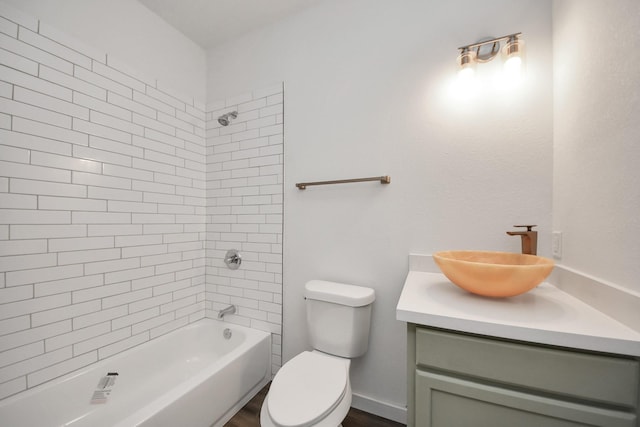 full bathroom featuring vanity, toilet, and tiled shower / bath combo