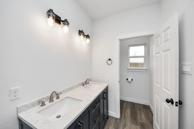 bathroom featuring vanity, toilet, and wood-type flooring