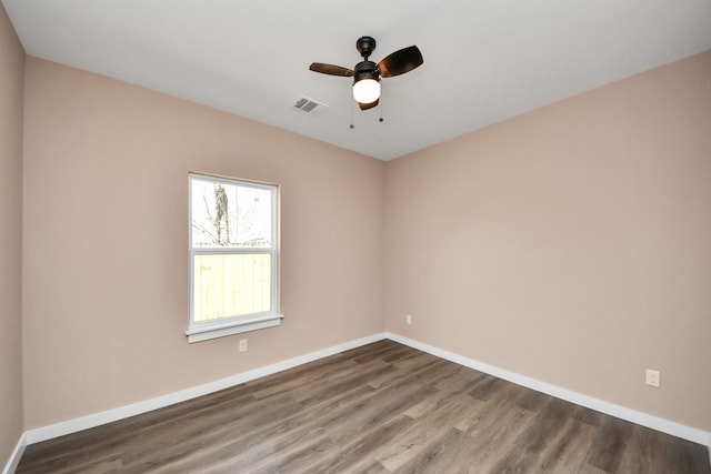 empty room featuring hardwood / wood-style floors and ceiling fan