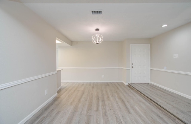 unfurnished room featuring light wood-type flooring