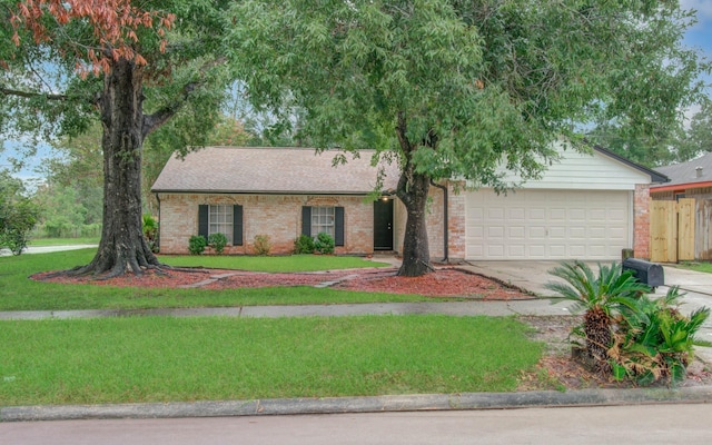 single story home with a garage and a front lawn