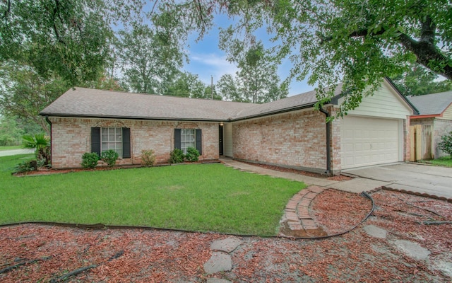 ranch-style house featuring a garage and a front yard