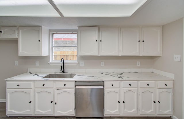 kitchen featuring white cabinetry, dishwasher, and sink