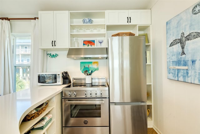 kitchen featuring stainless steel appliances and white cabinets