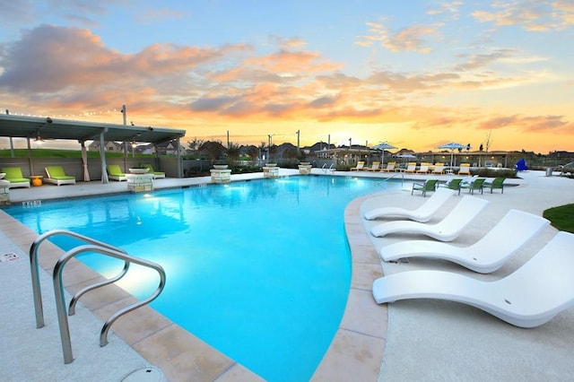 pool featuring a patio and fence