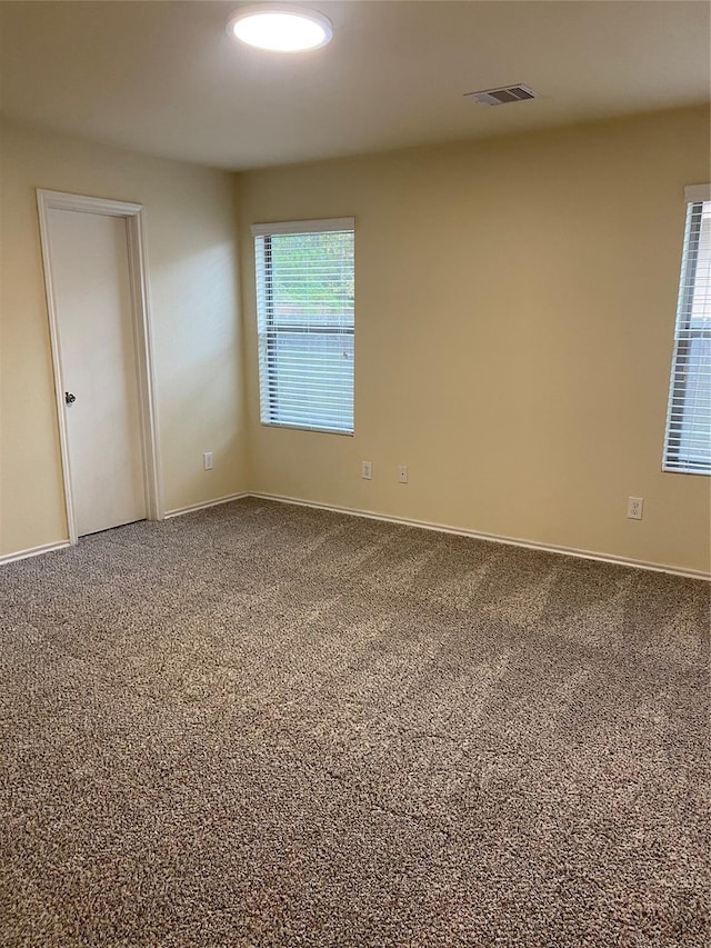 unfurnished room with carpet floors