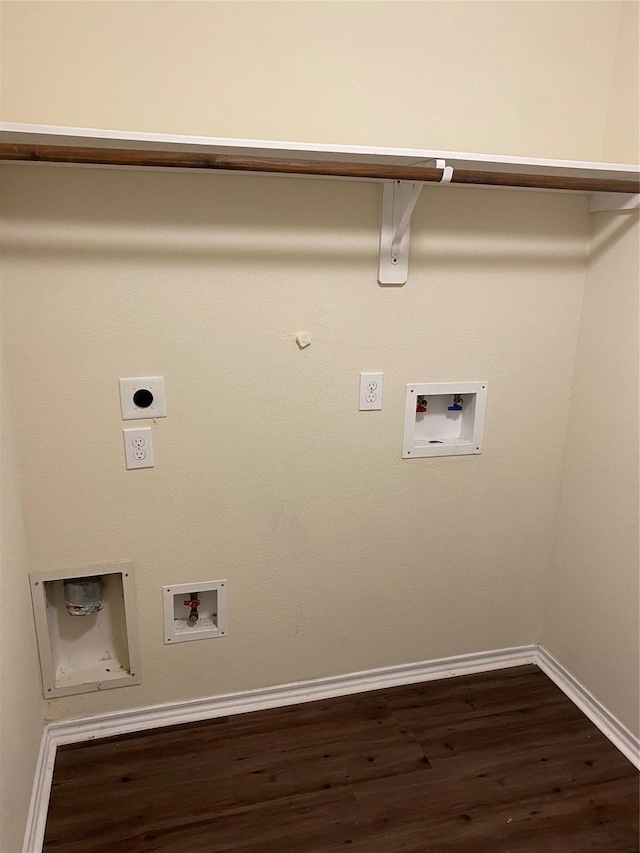 laundry room featuring gas dryer hookup, dark wood-type flooring, hookup for a washing machine, and electric dryer hookup