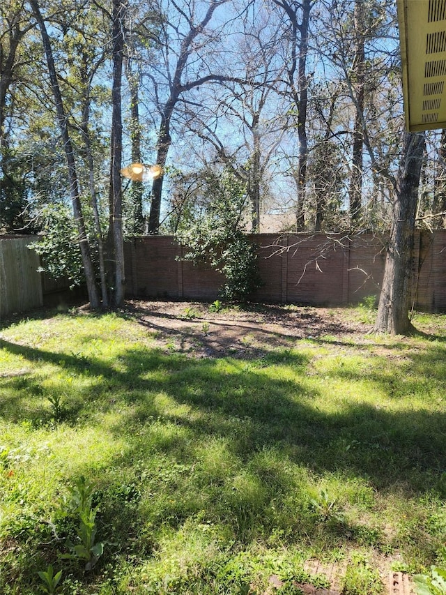 view of yard with fence