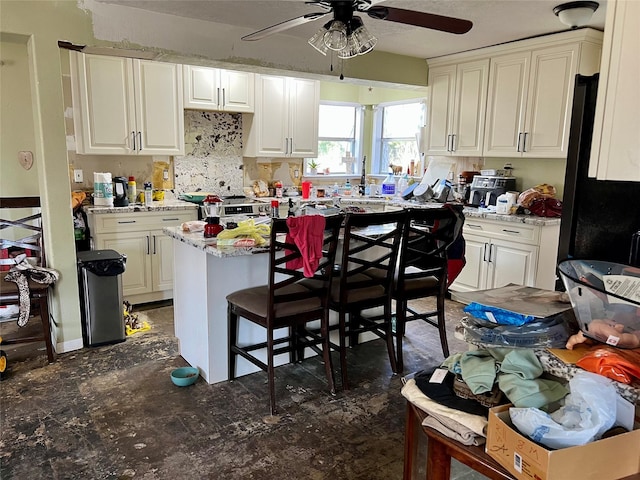 kitchen featuring a center island and white cabinets