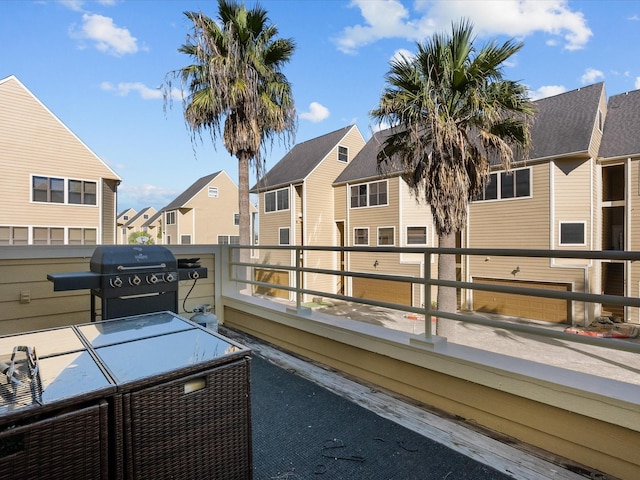 view of patio with a balcony and grilling area