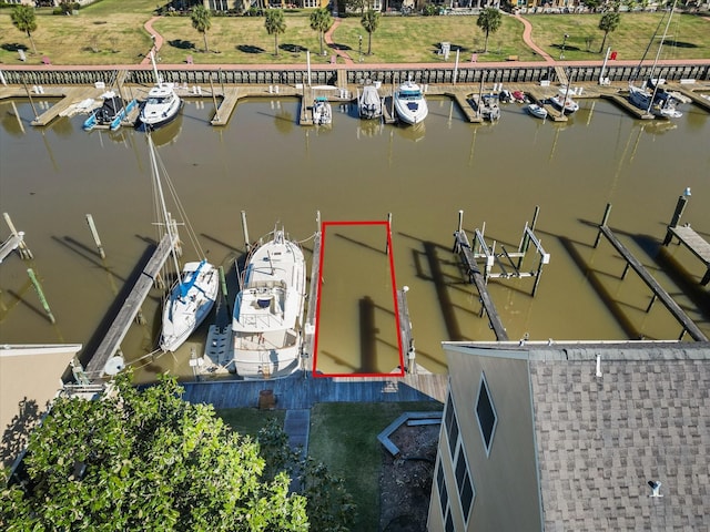 birds eye view of property featuring a water view