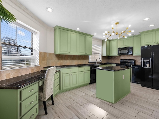 kitchen with decorative backsplash, black appliances, a center island, and green cabinetry