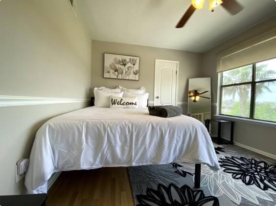 bedroom featuring ceiling fan and wood-type flooring