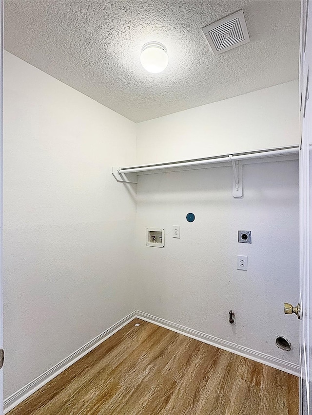 washroom with washer hookup, hookup for a gas dryer, visible vents, electric dryer hookup, and laundry area