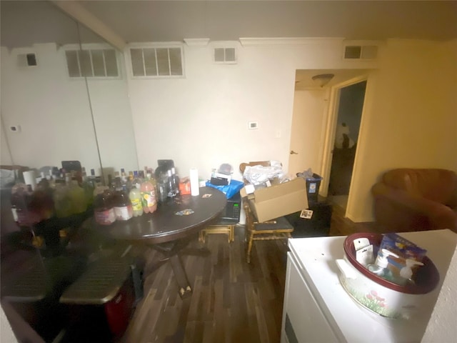 dining area with dark hardwood / wood-style flooring