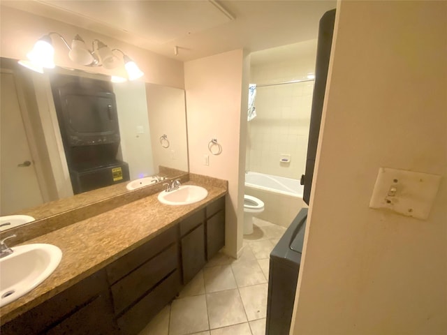 full bathroom featuring vanity, toilet, tiled shower / bath combo, and tile patterned flooring