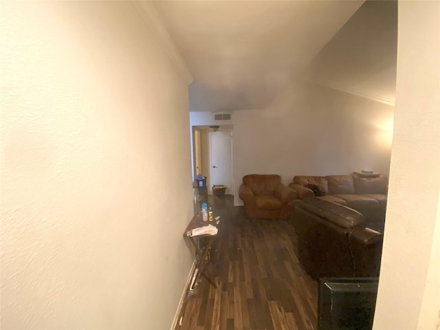 living room with crown molding and dark hardwood / wood-style floors