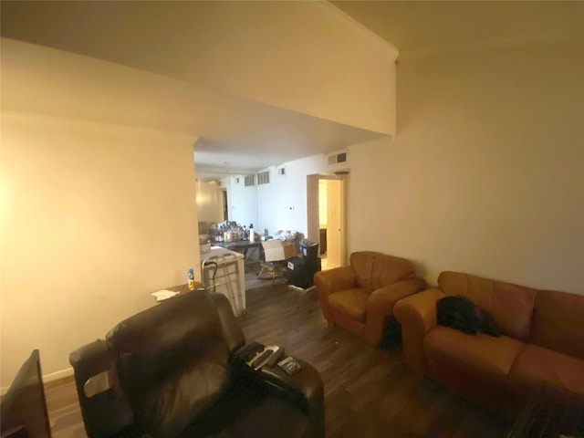 living room with dark hardwood / wood-style flooring