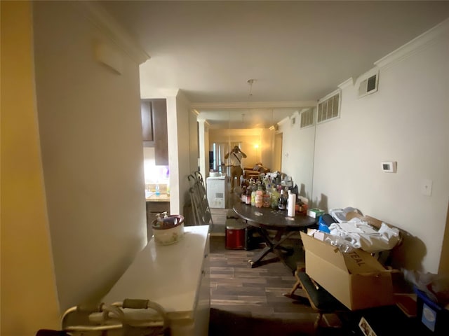 interior space featuring crown molding and dark hardwood / wood-style floors