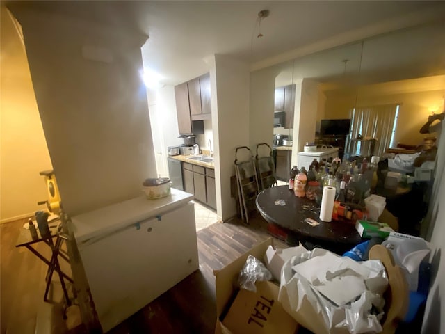 kitchen with sink and light hardwood / wood-style floors