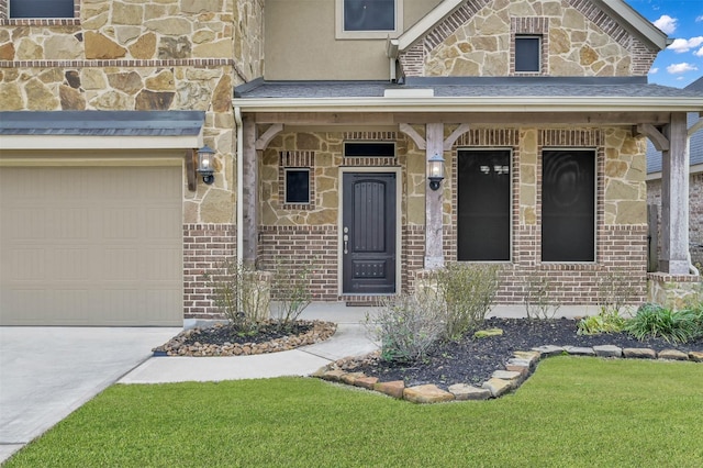 view of exterior entry featuring brick siding, stone siding, concrete driveway, and a garage