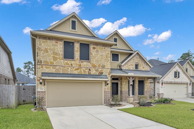 view of front of property with a garage and a front lawn