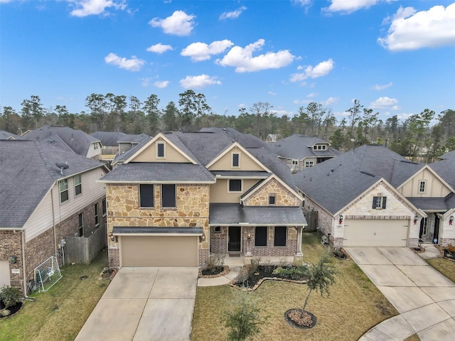 view of front of property featuring a garage and a front lawn