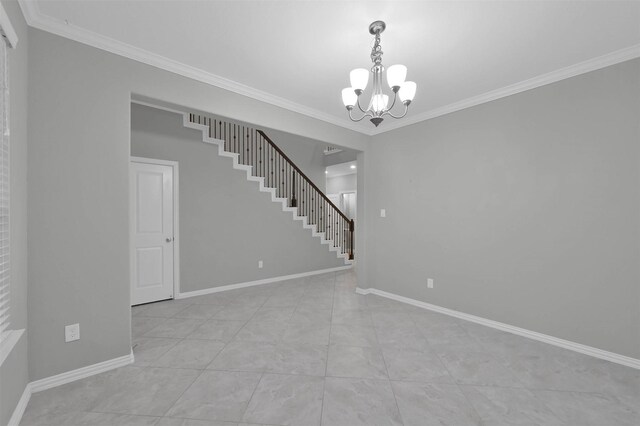 tiled spare room with an inviting chandelier and ornamental molding