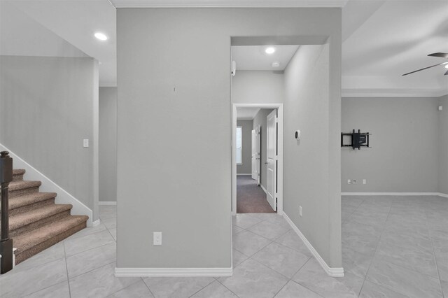 hall with light tile patterned floors