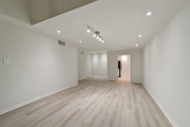 spare room with light hardwood / wood-style floors