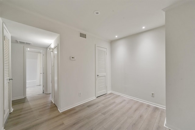 unfurnished room featuring light hardwood / wood-style floors