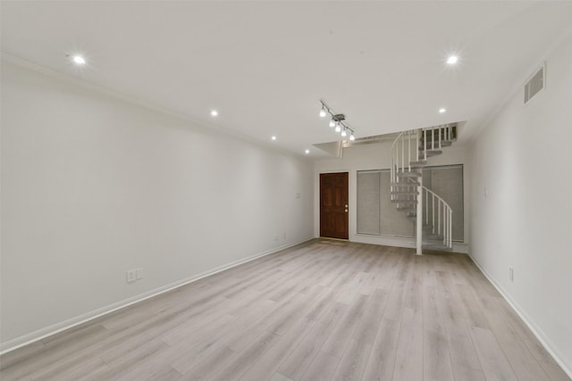 unfurnished living room featuring light hardwood / wood-style floors