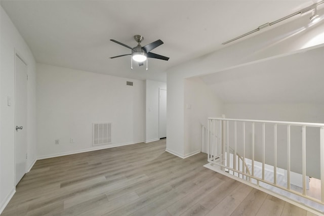 empty room featuring ceiling fan and light wood-type flooring