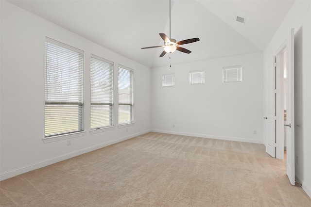 carpeted empty room with lofted ceiling and ceiling fan