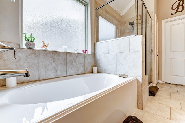 bathroom featuring ornamental molding and plus walk in shower