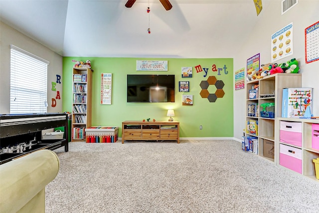 playroom featuring vaulted ceiling, carpet flooring, and ceiling fan