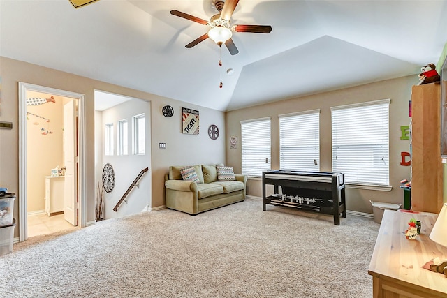 living room with lofted ceiling, light carpet, and ceiling fan