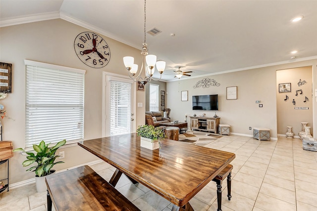 tiled dining area featuring vaulted ceiling, ceiling fan with notable chandelier, and crown molding