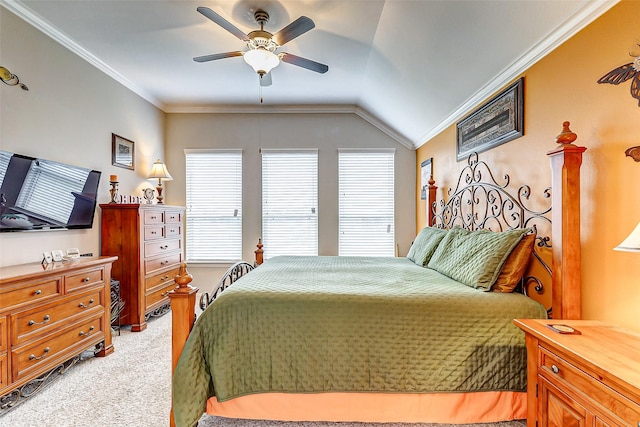 bedroom featuring vaulted ceiling, ornamental molding, carpet, and ceiling fan