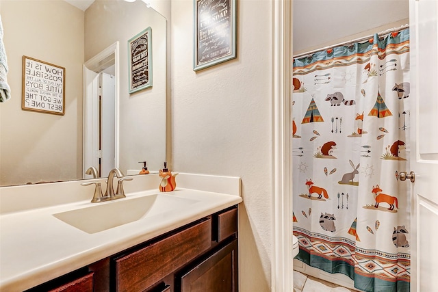 bathroom with vanity, walk in shower, and toilet