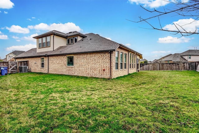 rear view of house with a lawn