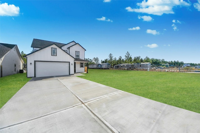 view of front of house with a garage and a front lawn