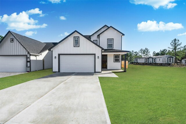 modern farmhouse featuring a garage and a front yard