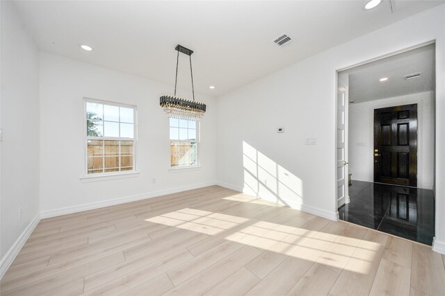 unfurnished dining area featuring light hardwood / wood-style floors