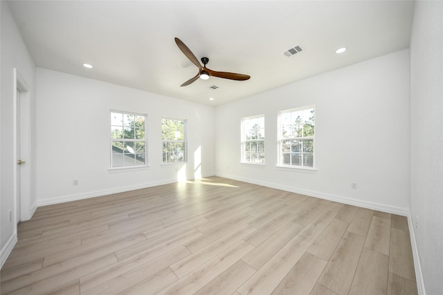 empty room with light hardwood / wood-style floors and ceiling fan