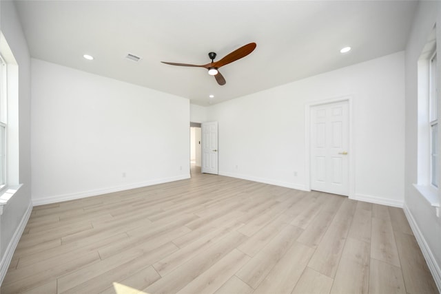 unfurnished room with ceiling fan and light hardwood / wood-style flooring