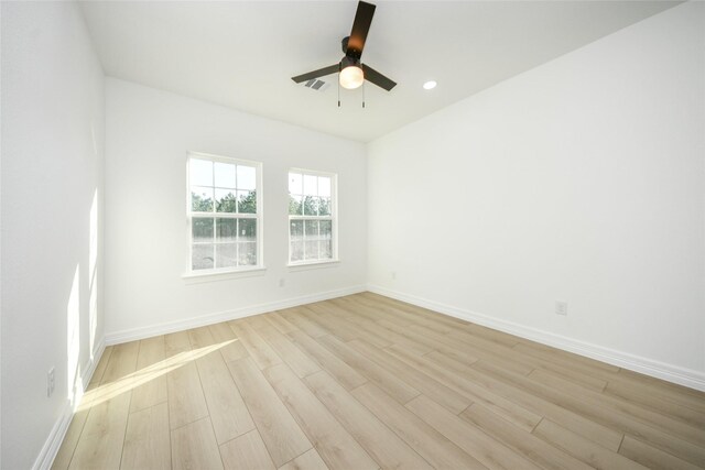 unfurnished room featuring ceiling fan and light hardwood / wood-style flooring