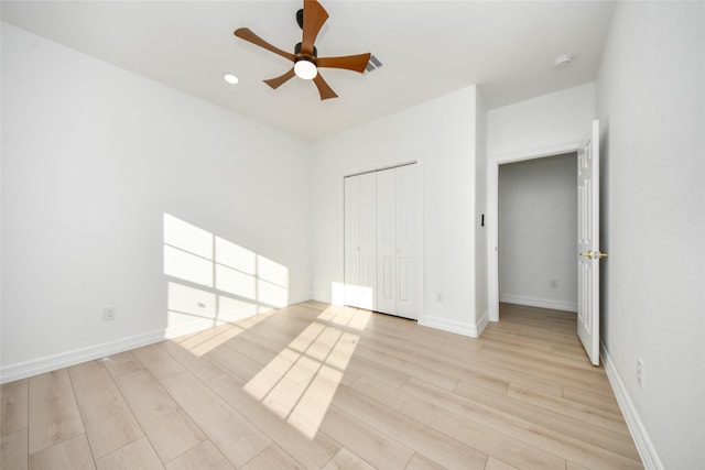 interior space with ceiling fan and light hardwood / wood-style flooring